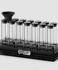 Single Dose Coffee Bean Storage Jars 14 Piece Glass Canisters With One Way Valve And Sturdy Metal Dispenser Stand showcasing 14 glass tubes on black rack.