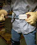 Worker demonstrating Heavy Duty Tool Belt with Mildew Resistant Cotton Polyester Webbing and a Forged Quick Release Buckle