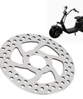 Metal Brake Disc Replacement for Electric Scooters with wear-resistant build shown with scooter for daily city rides in varied weather.