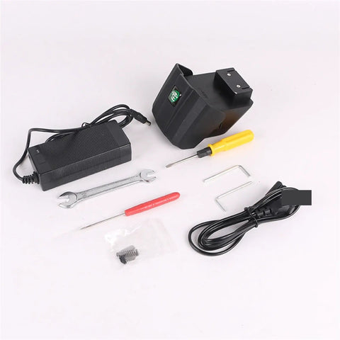 Electric Strapping Machine For Plastic And Steel Banding parts and tools, including charger, screwdriver, wrench, and cables.