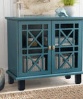 Blue cabinet with decorative glass doors and black adjustable legs, featuring baskets inside, displayed in a stylish interior.