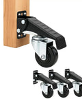 Heavy Duty Retractable Workbench Caster Wheel Set Solid Steel Frame With Durable Polyurethane Rollers gliding on wood, showing foot pedal lift.