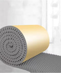 High Density Soundproofing Foam Panels Self Adhesive Egg Crate Acoustic Tiles For Home Studios And Chill Spaces rolled up, showing gray foam with yellow backing.