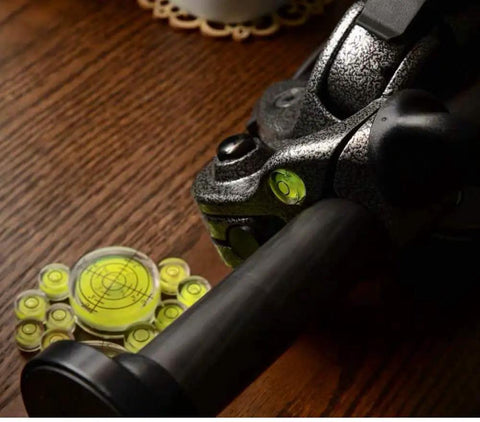 Set Of Six Hella Accurate Round Bubble Spirit Levels With Durable Waterproof Black Finish and Crisp Alignment Grooves for nailing every DJ Turntable Tripod Telescope or Bookshelf Project Today on a wooden table.