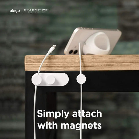Magnetic Cable Management Buttons And Holder To Keep Three Cables Neat And Tidy, with phone on wooden desk.