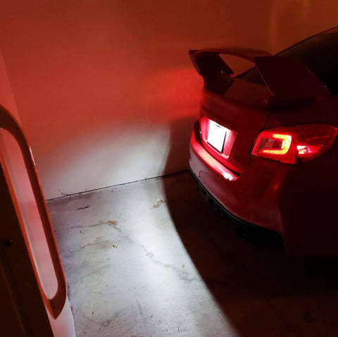 OEM-Fit 3W Full LED License Plate Light Kit illuminating the rear of Scion FR-S Subaru with 24-SMD Xenon White LEDs.