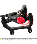 Side view of Z00M HB875E eBike hydraulic disc brake caliper; black body with red circular adjustment knob