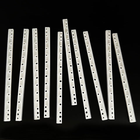 10 Pack 0.5 Module Plastic Gear Kit With Long Strip Rack Gear Pinion Transmission Rods shown on black surface