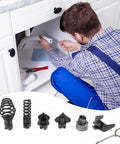 Man using electric drain cleaner cutter head kit under kitchen sink; tools and attachments visible for clogs.