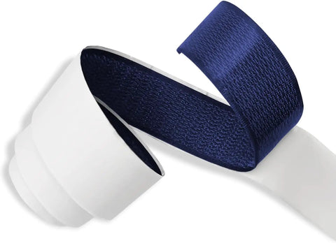 One Inch Wide Navy Hook And Loop Self Adhesive Tape Heavy Duty Blue Fastener Strips Tough As Nails rolled up on a white roll.