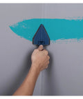 Hand using triangle cutter on wall to paint sharp edges, part of Premium 5 Piece Wall Paint Roller Brush Set Heavy Duty Rollers.