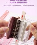 Hands holding Six Hole Puncher For A4 A5 B5 Loose Leaf Notebooks And Scrapbooks, showing compact design and plastic bottom pad.