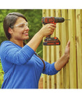 Woman using 20V Max Cordless Drill Driver Kit With Battery And Charger Includes Double Ended Bit Lightweight 3.15 Lbs 11 Position Clutch For Precision 0 To 650 RPM Delivers 115 Lbs Of Torque For Wood Metal Plastic Projects Your Go To Power Tool on wooden fence