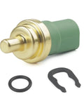 Engine coolant temperature sensor with brass tip and green plastic body, includes O-ring and retaining clip.