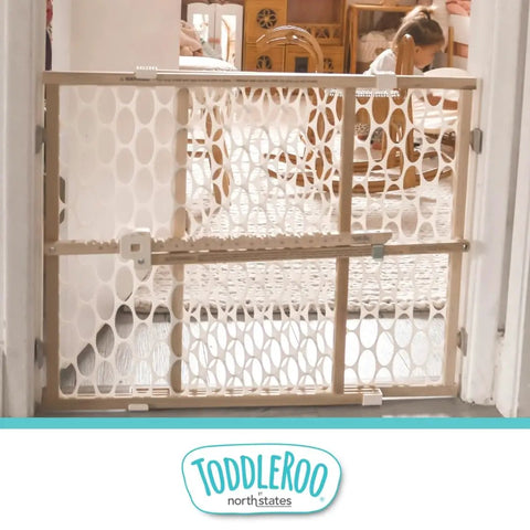 Wooden Baby Gate With Mesh For Doorways, Quick Fit Pressure Mounted, 26.5 to 42 inches wide, 23 inches tall, in cozy home setting