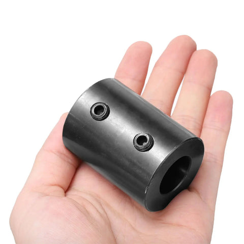 Three Quarters Inch Bore Shaft Coupling One And A Half Inch Outer Diameter Two Inch Length Black Oxide Plated Steel Rigid Coupler With Two Set Screws Motor Wheel Coupler Beefy Industrial Grade Part For Heavy Duty Power Transmission in hand