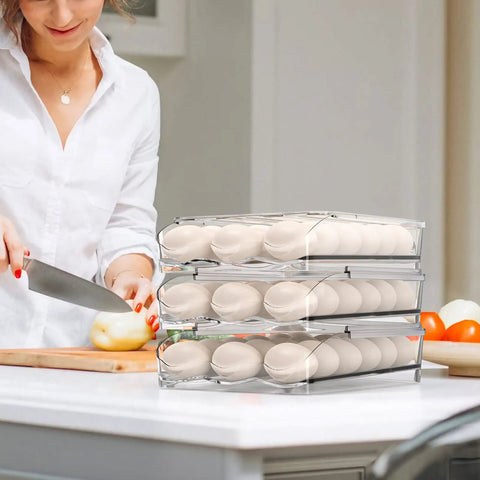 Auto Rolling Egg Holder For Refrigerator Two-Layer 36 Egg Capacity with eggs and woman chopping vegetables in kitchen