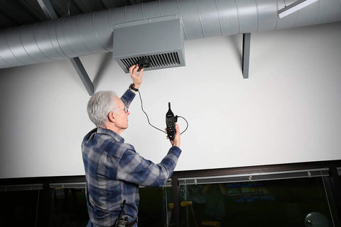 Technician using EM54 HVAC and Refrigeration Environmental Meter for Pros Continuity Testing of Nonenergized Components