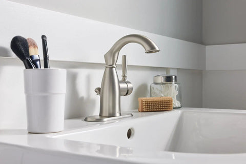 Sarona Spot Resist Brushed Nickel One Handle Bathroom Sink Faucet with Single Hole Design and Optional Deck Plate installed on sink