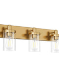Slick Gold Vanity Light With 3 Lights For Bathroom Over Mirror Modern Wall Sconce With Clear Glass Shades Durable Aluminum Construction 24.5 Inch Long Vanity Lighting Fixture No Bulbs Included showcasing elegant design and construction.