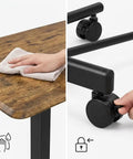 Cleaning the rustic timber top while adjusting the lockable wheel of the Rock Solid Mobile Standing Desk With Smooth Rollers And Quick Rise Adjustments For Effortless Sit Stand Transitions In Your Home Office Or Man Cave Featuring Classic Rustic Timber Top And Versatile Computer Workstation.