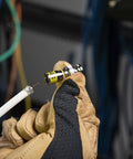 Installer holding Universal BNC Compression Coax Connector For RG6 And RG6 Quad Shield Cables, preparing for installation.