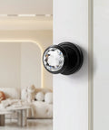 Gold Interior Privacy Glass Door Knob With Lock For Bedroom And Bathroom in polished brass finish, installed on white door.