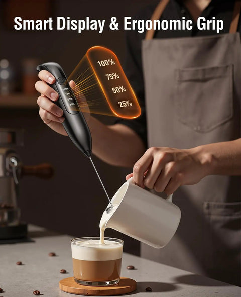 Person using Rechargeable Electric Milk Frother Handheld 3 In 1 With LED Display And Wireless Charging 3 Speeds Stainless Steel Whisk For Latte And Cappuccino Foam Pro Grade Battery Monitoring Easy Clean Bright Grey to froth milk into coffee.