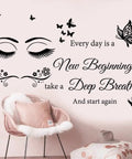 Every Day Is A New Beginning Inspirational Wall Art Sticker Set above plush chair in living room setting.