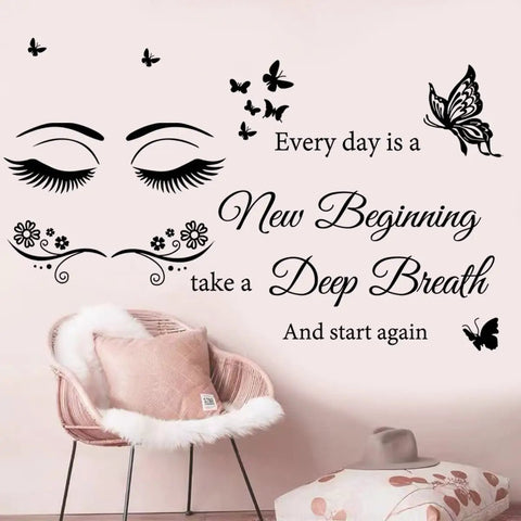 Every Day Is A New Beginning Inspirational Wall Art Sticker Set above plush chair in living room setting.