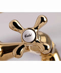 Close-up of polished brass cross handle labeled 'Cold' on Charleston Deck Mount Clawfoot Tub Filler With Hand Shower Six And A Half Inch Centerset