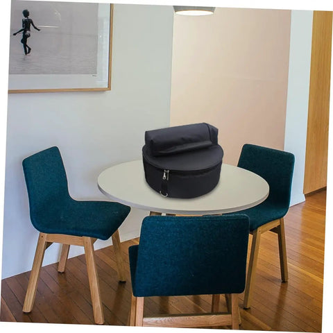 Waterproof Oxford Cloth Drum Backpack With Dead Easy Padded Straps And Adjustable Instrument Gig Bag on a table in a modern room.
