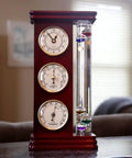Analog Weather Station With Galileo Thermometer And Quartz Clock In Gold Finish Dope Barometer And Hygrometer Indoor Outdoor Home Decor Gift For Family Or Friends displayed on a table.