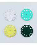 Four colorful watch dials in white, light blue, yellow, and green; design suitable for custom watch builds and replacements.