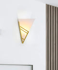 Modern Black Acrylic Wall Sconce Minimalist Bedroom Bedside Lamp With Uniform Soft Glow For Living Room Decor and Creative Lighting Fixture To Elevate Your Space With Luxe Chic Style on a wall with warm light.