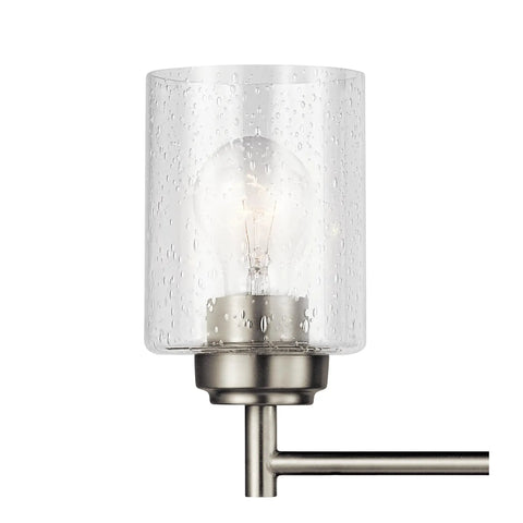 Close-up of Three Light Vanity Light In Brushed Nickel With Clear Seeded Glass, showcasing a single glass shade and brushed nickel arm