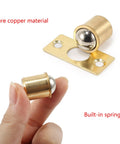 Close-up of Brass Door Ball Catch Hardware for Cabinets and Closets, highlighting pure copper material and built-in spring.