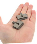 2 Pairs Bike Disc Brake Pads For Hydraulic And Mechanical Disc Brakes Replacement Pads For Mountain Bikes And Electric Scooters Quiet High Braking Power Wide Compatibility And Smooth Stopping On Rough Trails displayed on a hand