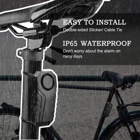 Beefy 113dB Wireless Bike Alarm With Remote Vibration And Motion Sensor IP55 Waterproof installed on bike handlebar in rain