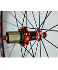 Close-up of 700C Road Bike Wheelset with Carbon Hub and 30mm Aluminum Double Wall Rim highlighting the quick release mechanism.