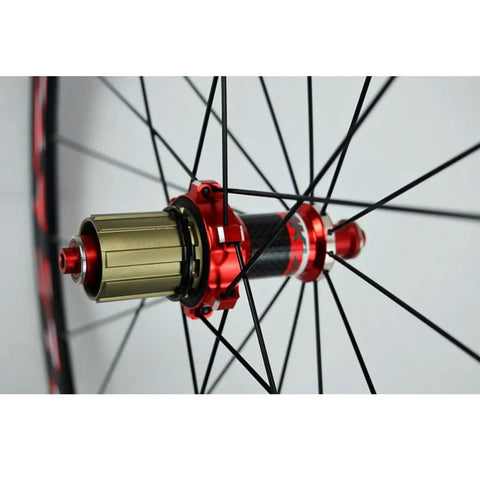 Close-up of 700C Road Bike Wheelset with Carbon Hub and 30mm Aluminum Double Wall Rim highlighting the quick release mechanism.