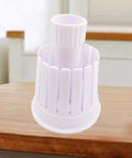 Front view of white plastic onion blossom maker, a kitchen cutter for making fried onion blossoms at home.