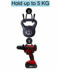 Magnetic Power Drill Tool Organizer Holder With Heavy Duty 2 Inch Opening Sweet For Garage Storage shown holding a drill and kettlebell.