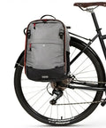 Bike with Go-To Pannier Backpack Convertible Lite 22L Weatherproof 2-In-1 Bike Commuting And Laptop Travel Bag attached to rear rack