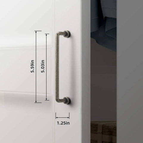 Close-up of Six Pack 5 Inch Center To Center Antique Silver Cabinet Bar Pulls on white cabinet door with dimensions shown.