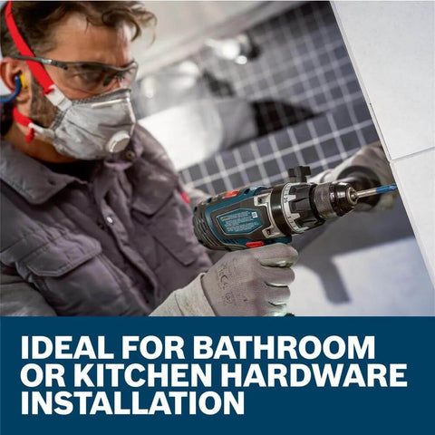 Bosch PTBX05 5-piece porcelain tile drill bit set used with a cordless drill on bathroom tile.