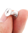 Fifty Pack Chicago Screws And Leather Rivets Featuring Phillips Cross Head Drive held in hand, stainless steel fastener for crafts.
