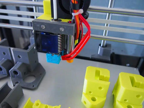 Solid Aluminum Frame Extrusion Kit For Hypercube Evolution 3D Printer With Complete Hardware And Sleek Black showing printed yellow components and extruder assembly.