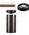 Turn Up Your Kitchen Game With This Super Durable Vacuum Sealed Glass Jar Built For Coffee Beans And Dry Goods. 1200Ml clear glass canister filled with coffee beans.