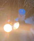 Beast 500W Micro Hydroelectric Turbine Generator installed outdoors with lit bulbs for off-grid lighting